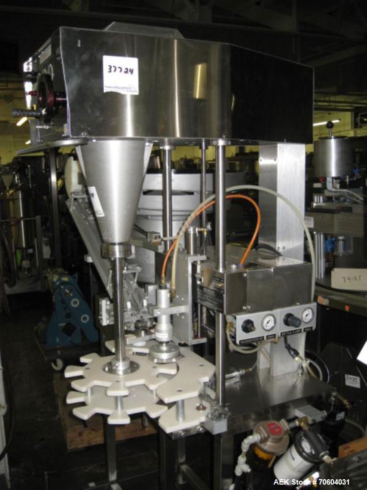 Used Kalish Starcap Automatic Chuck Capper. Capable of speeds up to 80 bottles per minute. Cap size range: 13mm to 58mm with changeparts. Currently set up on 43mm diam caps. Has a vibratory bowl feed...