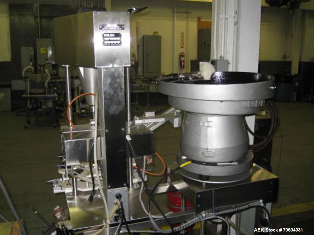 Used Kalish Starcap Automatic Chuck Capper. Capable of speeds up to 80 bottles per minute. Cap size range: 13mm to 58mm with changeparts. Currently set up on 43mm diam caps. Has a vibratory bowl feed...
