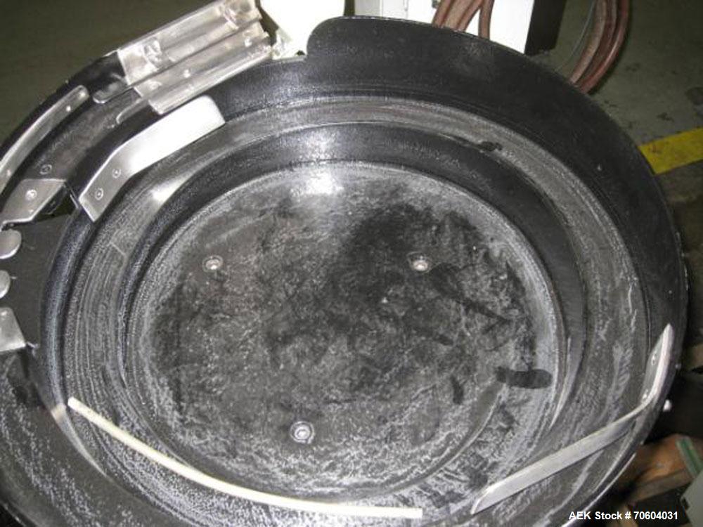 Used Kalish Starcap Automatic Chuck Capper. Capable of speeds up to 80 bottles per minute. Cap size range: 13mm to 58mm with changeparts. Currently set up on 43mm diam caps. Has a vibratory bowl feed...