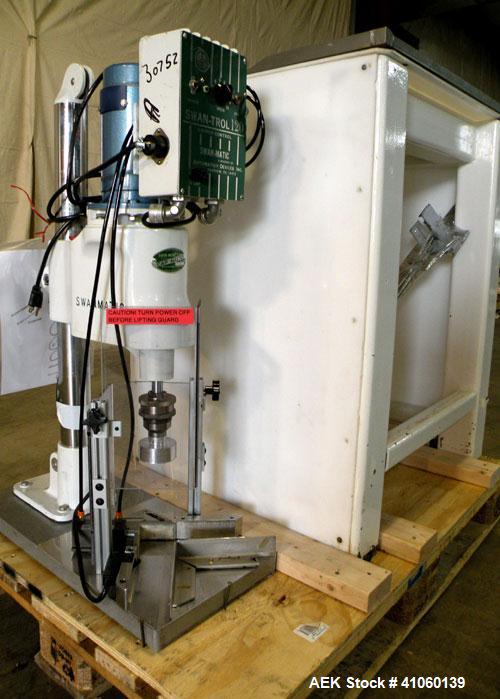Used Swan-Matic Cap Master Single Cycle Bench Top Capper, Model C-300. Up to 40 strokes per minute. Driven by a  1/4 hp, 0-100 volt, 1800 rpm motor. Adjustable height for up to 13" tall containers. C...