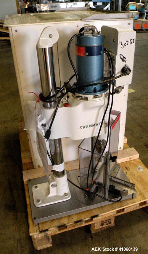 Used Swan-Matic Cap Master Single Cycle Bench Top Capper, Model C-300. Up to 40 strokes per minute. Driven by a  1/4 hp, 0-100 volt, 1800 rpm motor. Adjustable height for up to 13" tall containers. C...