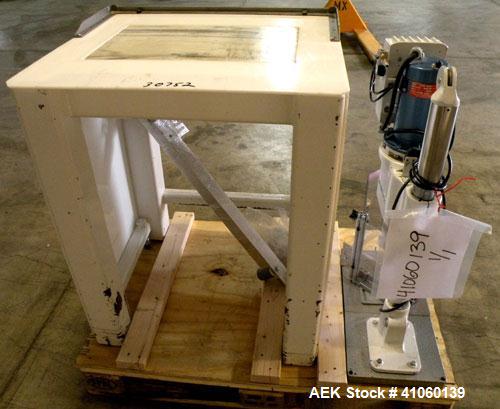 Used Swan-Matic Cap Master Single Cycle Bench Top Capper, Model C-300. Up to 40 strokes per minute. Driven by a  1/4 hp, 0-100 volt, 1800 rpm motor. Adjustable height for up to 13" tall containers. C...
