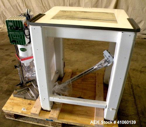 Used Swan-Matic Cap Master Single Cycle Bench Top Capper, Model C-300. Up to 40 strokes per minute. Driven by a  1/4 hp, 0-100 volt, 1800 rpm motor. Adjustable height for up to 13" tall containers. C...