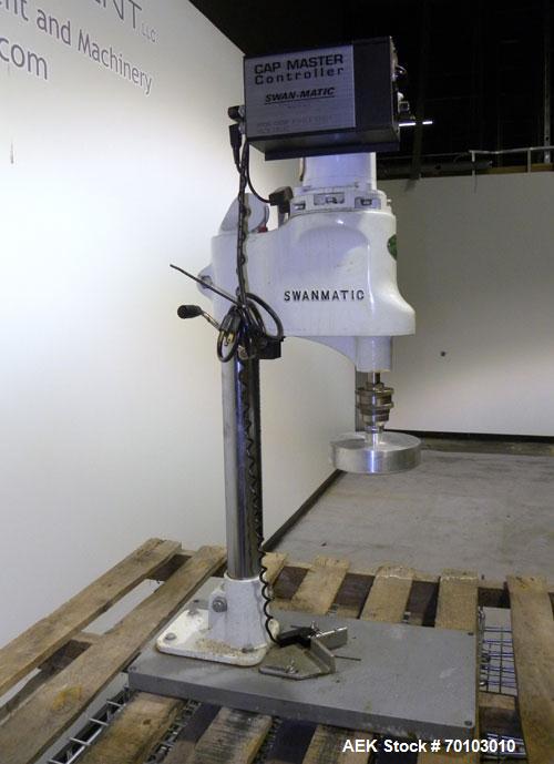 Used Swan-Matic Cap Master Single Cycle Bench Top Capper, Model C300. Up to 40 caps per minute. Driven by a 1/4 hp, 90 volt, 1750 rpm DC motor with a Swan-Matic model C302E  controller. Manual adjust...