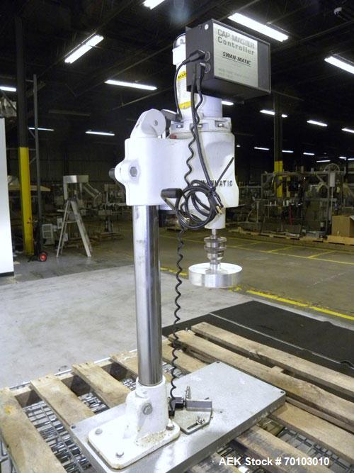 Used Swan-Matic Cap Master Single Cycle Bench Top Capper, Model C300. Up to 40 caps per minute. Driven by a 1/4 hp, 90 volt, 1750 rpm DC motor with a Swan-Matic model C302E  controller. Manual adjust...