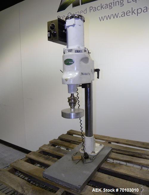Used Swan-Matic Cap Master Single Cycle Bench Top Capper, Model C300. Up to 40 caps per minute. Driven by a 1/4 hp, 90 volt, 1750 rpm DC motor with a Swan-Matic model C302E  controller. Manual adjust...