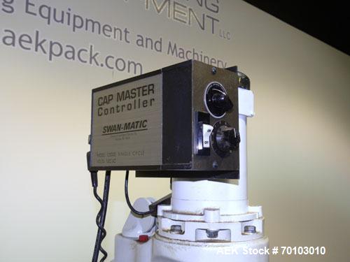 Used Swan-Matic Cap Master Single Cycle Bench Top Capper, Model C300. Up to 40 caps per minute. Driven by a 1/4 hp, 90 volt, 1750 rpm DC motor with a Swan-Matic model C302E  controller. Manual adjust...
