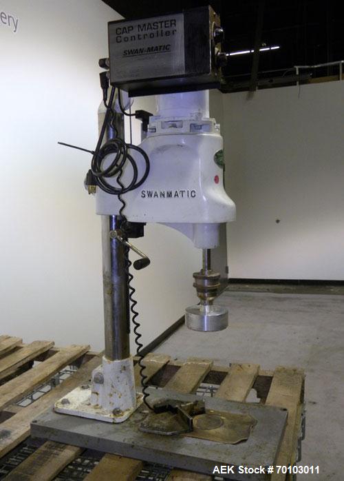 Used Swan-Matic Cap Master Single Cycle Bench Top Capper, Model C300. Up to 40 caps per minute. Driven by a 1/4 hp, 90 volt, 1750 rpm DC motor with a Swan-Matic model C302E controller. Manual adjusta...
