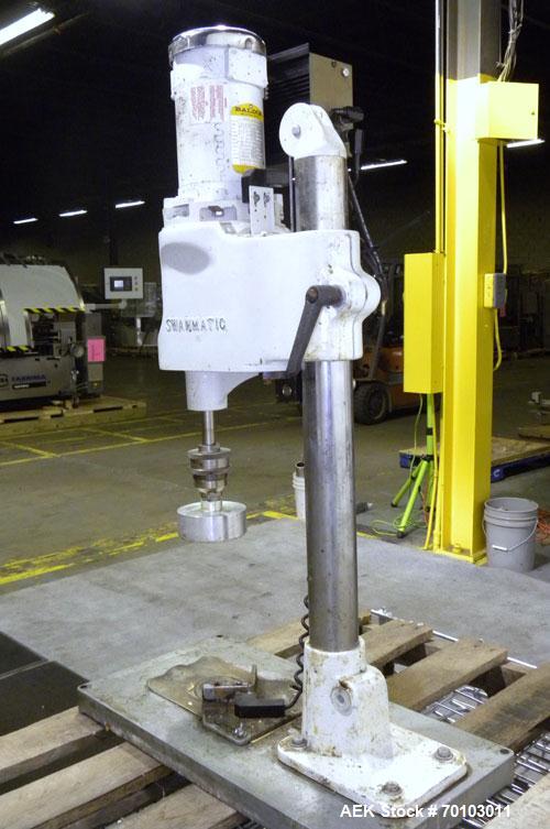 Used Swan-Matic Cap Master Single Cycle Bench Top Capper, Model C300. Up to 40 caps per minute. Driven by a 1/4 hp, 90 volt, 1750 rpm DC motor with a Swan-Matic model C302E controller. Manual adjusta...