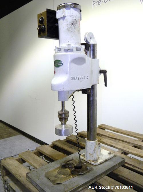 Used Swan-Matic Cap Master Single Cycle Bench Top Capper, Model C300. Up to 40 caps per minute. Driven by a 1/4 hp, 90 volt, 1750 rpm DC motor with a Swan-Matic model C302E controller. Manual adjusta...