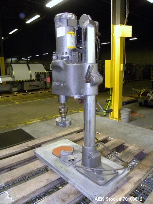 Used Swanmatic Cap Master Single Cycle Bench Top Capper, Model C300. Up to 40 caps per minute. Driven by a 1/4 hp, 90 volt, 1750 rpm DC motor with a Swan-Matic model C302E controller. Manual adjustab...