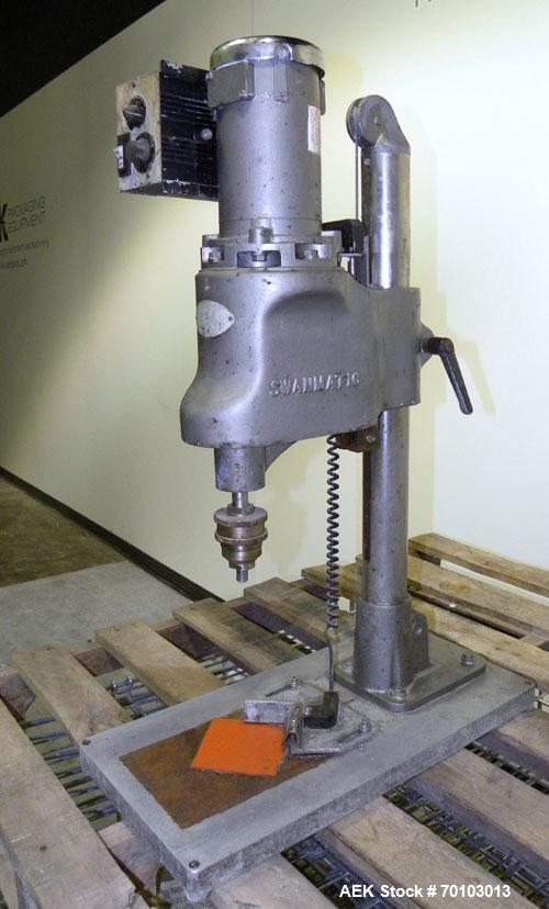 Used Swan-Matic Cap Master Single Cycle Bench Top Capper, Model C300. Up to 40 caps per minute. Driven by a 1/4 hp, 90 volt, 1750 rpm DC motor with a Swan-Matic model C302E controller. Manual adjusta...