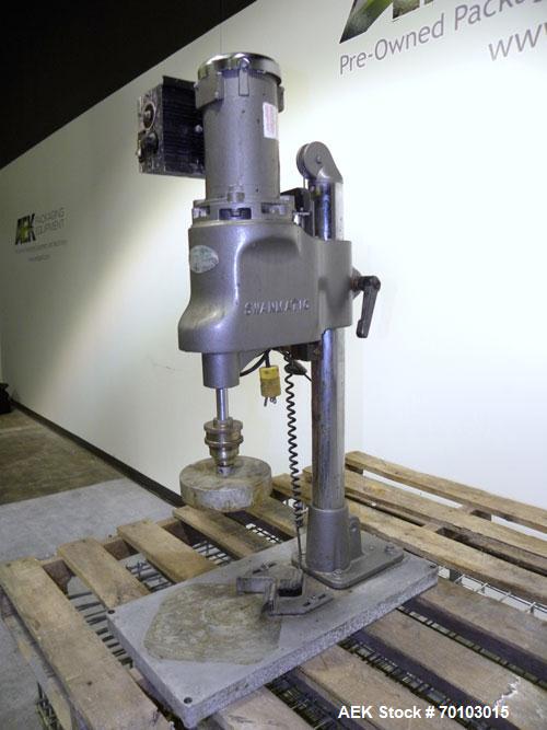 Used Swan-Matic Cap Master Single Cycle Bench Top Capper, Model C300. Up to 40 caps per minute. Driven by a 1/4 hp, 90 volt, 1750 rpm DC motor with a Swan-Matic model C302E controller. Manual adjusta...
