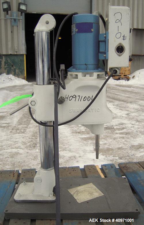 Used Swanmatic Cap Master Cap Tightener.Size range varies from 15-135 mm.Horizontally adjustable.Missing capper chuck.Driven by a 1/4 hp, 0/100 volt, 1800 rpm DC motor.Includes a Swan-Trol 120 capper...