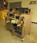 Used Kalish (IMA) Starcap Model 5123 Single Head Chuck Capper. Machine is capable of speeds up to 90 bottles per minute. Container size range: (height) 1-1/2