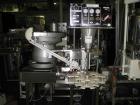 Used Kalish Starcap Automatic Chuck Capper. Capable of speeds up to 80 bottles per minute. Cap size range: 13mm to 58mm with changeparts. Currently set up on 43mm diam caps. Has a vibratory bowl feed...