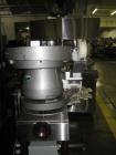 Used Kalish Starcap Automatic Chuck Capper. Capable of speeds up to 80 bottles per minute. Cap size range: 13mm to 58mm with changeparts. Currently set up on 43mm diam caps. Has a vibratory bowl feed...