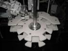 Used Kalish Starcap Automatic Chuck Capper. Capable of speeds up to 80 bottles per minute. Cap size range: 13mm to 58mm with changeparts. Currently set up on 43mm diam caps. Has a vibratory bowl feed...