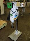 Used Swan-Matic Cap Master Single Cycle Bench Top Capper, Model 49VS. Up to 43 strokes per minute. Driven by a  1/4 hp DC motor with SCR controller. Adjustable height for up to 13’’ tall containers.