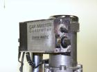 Used Swanmatic Cap Master Single Cycle Bench Top Capper, Model C300. Up to 40 caps per minute. Driven by a 1/4 hp, 90 volt, 1750 rpm DC motor with a Swan-Matic model C302E controller. Manual adjustab...