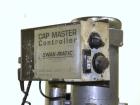 Used Swan-Matic Cap Master Single Cycle Bench Top Capper, Model C300. Up to 40 caps per minute. Driven by a 1/4 hp, 90 volt, 1750 rpm DC motor with a Swan-Matic model C302E controller. Manual adjusta...