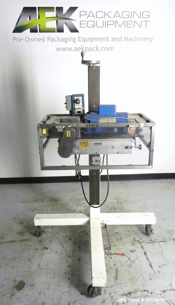 Used Eaton Dynamics overcapper belt capper.