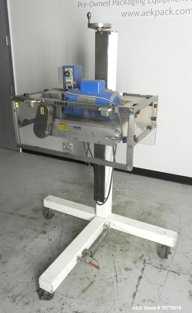 Used Eaton Dynamics overcapper belt capper.