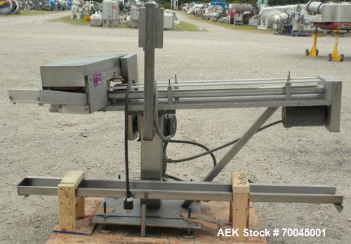 Used Holmatic Horizontal Overcapper/Lidder, stainless/aluminum construction, model PH-31. Last running 211 lids. 46" long single lane rollers, driven by a 1/4 hp, 3/60/230/460 volt, 1725 rpm motor. R...