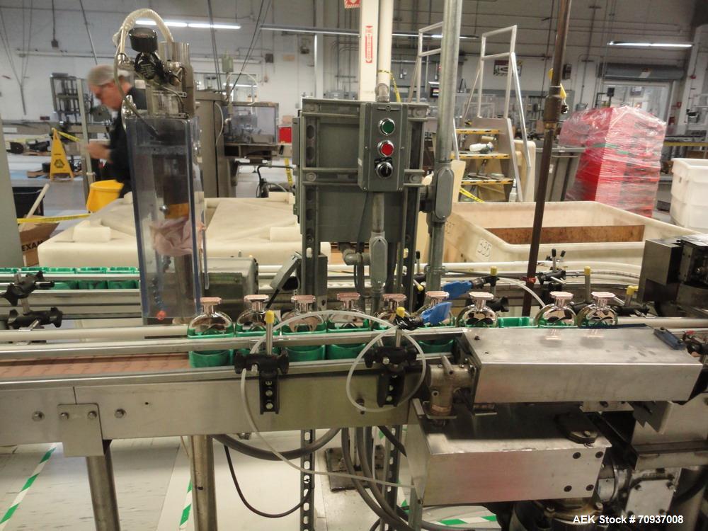 Used Intermittent Motion Push Type over cap press on station.  

