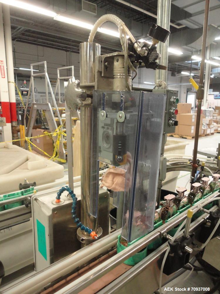Used Intermittent Motion Push Type over cap press on station.  

