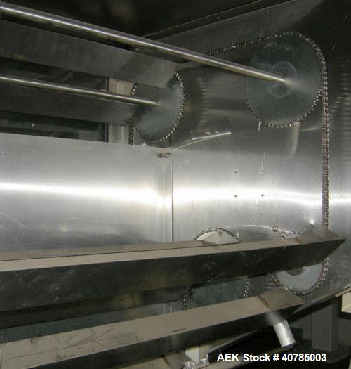 Used Fords Holmatic Lid Feeder, Model SM 3000. 34 1/2" long x 6" wide x approximately 3" deep stainless steel buckets. Driven by a variable speed motor. 1/60/120 volt, 12.5 amps, 10 cfm, 80 psi.