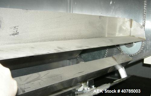 Used Fords Holmatic Lid Feeder, Model SM 3000. 34 1/2" long x 6" wide x approximately 3" deep stainless steel buckets. Driven by a variable speed motor. 1/60/120 volt, 12.5 amps, 10 cfm, 80 psi.