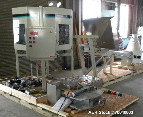 Used Universal Dose Cup Feeder and Applicator, Model E-7586. Line consists of: (1) Pharmaceutical Centrifugal Hoppman Feeder, Model FT401RLDCA, Serial number FT401RLDCA00095, built in 2002. Machine i...