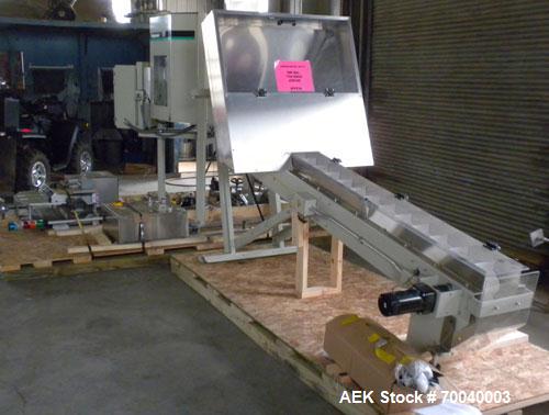 Used Universal Dose Cup Feeder and Applicator, Model E-7586. Line consists of: (1) Pharmaceutical Centrifugal Hoppman Feeder, Model FT401RLDCA, Serial number FT401RLDCA00095, built in 2002. Machine i...