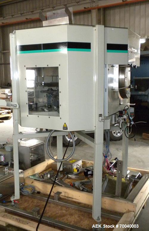 Used Universal Dose Cup Feeder and Applicator, Model E-7586. Line consists of: (1) Pharmaceutical Centrifugal Hoppman Feeder, Model FT401RLDCA, Serial number FT401RLDCA00095, built in 2002. Machine i...