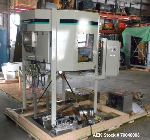 Used Universal Dose Cup Feeder and Applicator, Model E-7586. Line consists of: (1) Pharmaceutical Centrifugal Hoppman Feeder, Model FT401RLDCA, Serial number FT401RLDCA00095, built in 2002. Machine i...