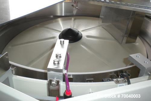 Used Universal Dose Cup Feeder and Applicator, Model E-7586. Line consists of: (1) Pharmaceutical Centrifugal Hoppman Feeder, Model FT401RLDCA, Serial number FT401RLDCA00095, built in 2002. Machine i...