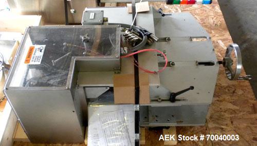 Used Universal Dose Cup Feeder and Applicator, Model E-7586. Line consists of: (1) Pharmaceutical Centrifugal Hoppman Feeder, Model FT401RLDCA, Serial number FT401RLDCA00095, built in 2002. Machine i...