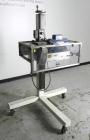 Used Eaton Dynamics overcapper belt capper.
