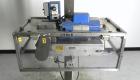 Used Eaton Dynamics overcapper belt capper.