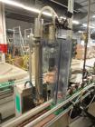 Used Intermittent Motion Push Type over cap press on station.  

