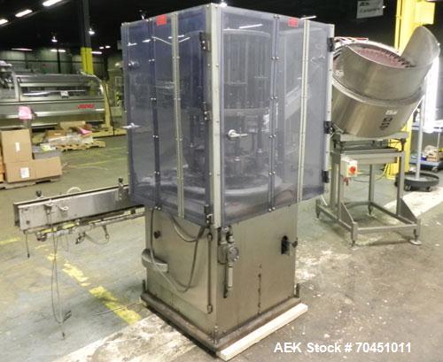 Used Anderson Model C-800 8-Head Rotary Pump Placer and Crimper for fragrance, perfume and cologne. Aluminum body finger pump sprayers crimped to glass containers. Has PMC model MM36 valve stem sorte...