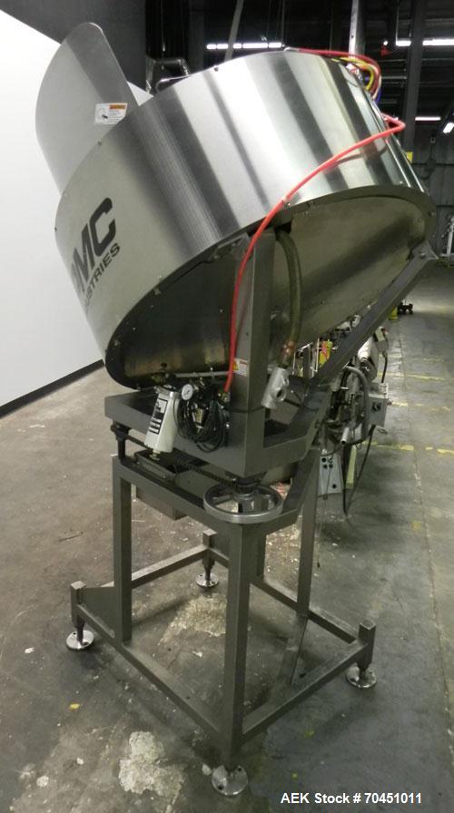 Used Anderson Model C-800 8-Head Rotary Pump Placer and Crimper for fragrance, perfume and cologne. Aluminum body finger pump sprayers crimped to glass containers. Has PMC model MM36 valve stem sorte...