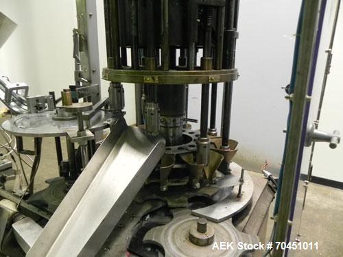 Used Anderson Model C-800 8-Head Rotary Pump Placer and Crimper for fragrance, perfume and cologne. Aluminum body finger pump sprayers crimped to glass containers. Has PMC model MM36 valve stem sorte...