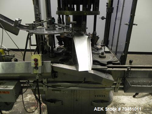 Used Anderson Model C-800 8-Head Rotary Pump Placer and Crimper for fragrance, perfume and cologne. Aluminum body finger pump sprayers crimped to glass containers. Has PMC model MM36 valve stem sorte...