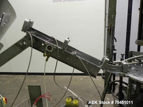 Used Anderson Model C-800 8-Head Rotary Pump Placer and Crimper for fragrance, perfume and cologne. Aluminum body finger pump sprayers crimped to glass containers. Has PMC model MM36 valve stem sorte...