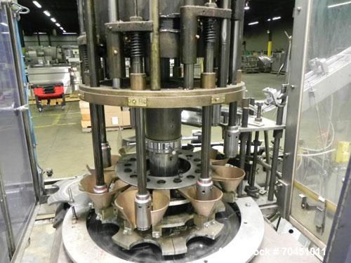 Used Anderson Model C-800 8-Head Rotary Pump Placer and Crimper for fragrance, perfume and cologne. Aluminum body finger pump sprayers crimped to glass containers. Has PMC model MM36 valve stem sorte...