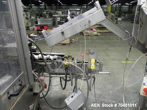 Used Anderson Model C-800 8-Head Rotary Pump Placer and Crimper for fragrance, perfume and cologne. Aluminum body finger pump sprayers crimped to glass containers. Has PMC model MM36 valve stem sorte...