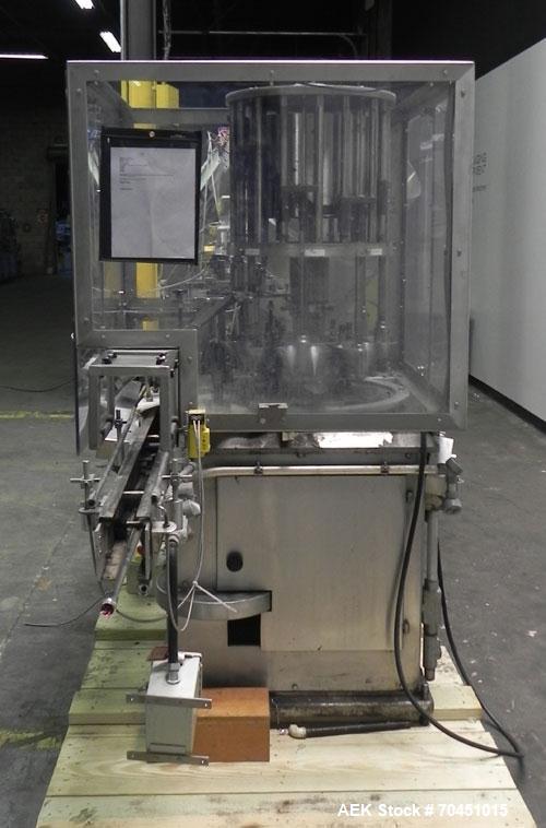 Used Anderson 8 Head Rotary Pump Placer and Crimper for fragrance, perfume and cologne. Aluminum body fragrance finger pump sprayers crimped to glass containers. Has PMC model MM36 valve stem sorter ...