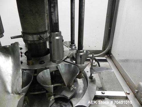 Used Anderson 8 Head Rotary Pump Placer and Crimper for fragrance, perfume and cologne. Aluminum body fragrance finger pump sprayers crimped to glass containers. Has PMC model MM36 valve stem sorter ...